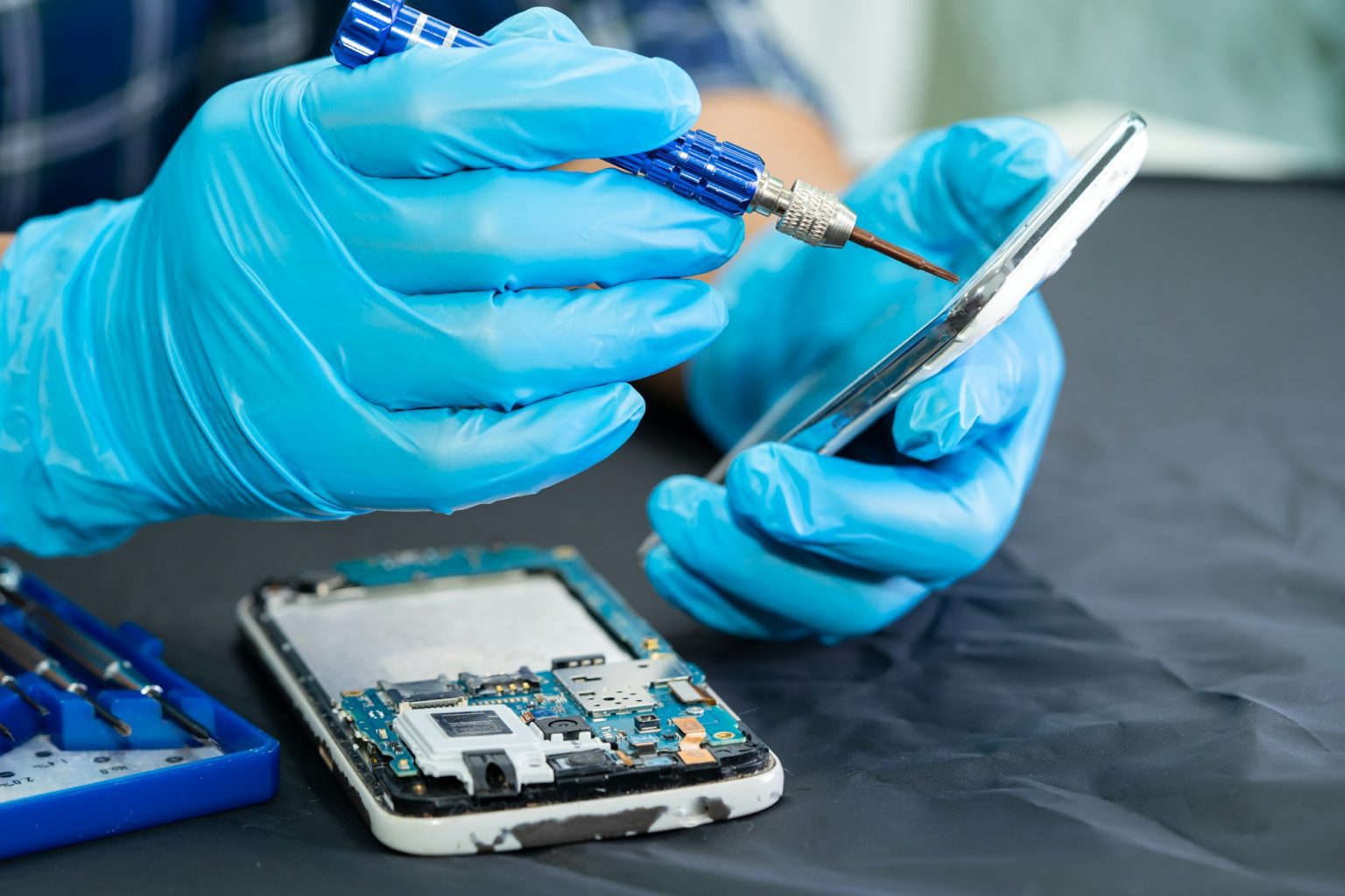 technician-repairing-mobile-phone